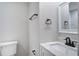 Well-lit bathroom with a sink, toilet, and matte black hardware at 1986 Elaine St, Johns Island, SC 29455