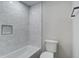 Shower and toilet area featuring white tile, built-in niche, and matte black hardware at 1986 Elaine St, Johns Island, SC 29455