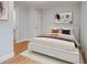 Stylized bedroom with wood floors, neutral decor, white trim, and modern furnishings at 1986 Elaine St, Johns Island, SC 29455