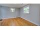 Cozy bedroom with hardwood floors and two windows offering ample natural light at 1986 Elaine St, Johns Island, SC 29455