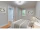 Stylized bedroom with wood floors and an ensuite bathroom at 1986 Elaine St, Johns Island, SC 29455