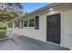 Welcoming entryway with black door and white painted brick at 1986 Elaine St, Johns Island, SC 29455