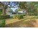 Charming two-story home with manicured lawn and mature trees, offering classic curb appeal at 1986 Elaine St, Johns Island, SC 29455