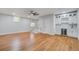 Spacious living area with hardwood floors and a modern bar area with white cabinets at 1986 Elaine St, Johns Island, SC 29455