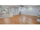 Open-concept living room featuring hardwood floors, natural light, and a view into the modern kitchen at 1986 Elaine St, Johns Island, SC 29455
