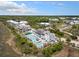 Captivating aerial view of a resort with multiple pools, lush landscaping, and picturesque waterfront surroundings at 2229 Boatwright Rd, Johns Island, SC 29455