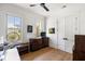Comfortable bedroom with hardwood floors, ample natural light, and a view of the property at 2229 Boatwright Rd, Johns Island, SC 29455