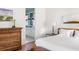Cozy bedroom with an ensuite bathroom featuring light blue accents and wood floors at 2229 Boatwright Rd, Johns Island, SC 29455