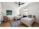 Charming bedroom features hardwood floors, comfortable beds, and ample natural light from a window at 2229 Boatwright Rd, Johns Island, SC 29455