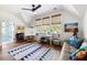 Bedroom converted into an art studio featuring hardwood floors, natural light, and unique artist furniture at 2229 Boatwright Rd, Johns Island, SC 29455