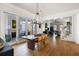 Open dining area with a large wooden table, stylish chandelier, and seamless access to the living room at 2229 Boatwright Rd, Johns Island, SC 29455