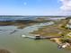Aerial view of a private boat dock with a charming gazebo and waterway at 2229 Boatwright Rd, Johns Island, SC 29455