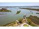 Wide aerial view of boat dock and kayaks with stone path leading from property at 2229 Boatwright Rd, Johns Island, SC 29455