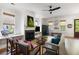 Elegant living room with a fireplace, cozy seating, and natural light from large windows at 2229 Boatwright Rd, Johns Island, SC 29455