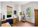 Bright home office features hardwood floors, plenty of natural light, and custom built-ins for efficient storage solutions at 2229 Boatwright Rd, Johns Island, SC 29455