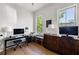 Bedroom converted into an office with hardwood floors, ample natural light, and a view of the property at 2229 Boatwright Rd, Johns Island, SC 29455
