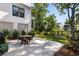 Charming patio with outdoor table and chairs, perfect for relaxing and enjoying the landscaped backyard at 2229 Boatwright Rd, Johns Island, SC 29455