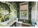 Stylish powder room featuring bold wallpaper, a unique sink, and a window with a view at 2229 Boatwright Rd, Johns Island, SC 29455
