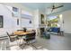 Charming screened porch featuring a dining area and fireplace with views of the surrounding greenery at 2229 Boatwright Rd, Johns Island, SC 29455