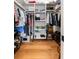 Spacious walk-in closet with ample storage, built-in shelves, and wood floors at 2229 Boatwright Rd, Johns Island, SC 29455