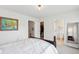 Bedroom with natural light, and neutral walls and carpeting, complete with a closet and full bath at 241 Howle Ave # F, Charleston, SC 29412