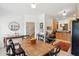 Bright dining area featuring hardwood table, black chairs, and decorative wall art at 241 Howle Ave # F, Charleston, SC 29412