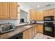 Bright kitchen featuring light-colored cabinets, stainless steel appliances, and tiled flooring at 241 Howle Ave # F, Charleston, SC 29412