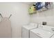 Functional laundry room with a washer, dryer, and storage shelving at 241 Howle Ave # F, Charleston, SC 29412