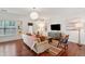 Modern living room featuring hardwood floors, a large window and comfortable seating area at 241 Howle Ave # F, Charleston, SC 29412