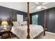 Dark Bedroom featuring a four-poster bed and a calming color palette at 241 Howle Ave # F, Charleston, SC 29412