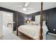 Cozy main bedroom with a four-poster bed, wall-to-wall carpeting, and modern lighting at 241 Howle Ave # F, Charleston, SC 29412