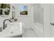 Bright bathroom featuring white marble tile, a sleek vanity, and modern fixtures at 2462 Swallow Dr, Charleston, SC 29414