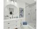 Modern bathroom with a walk-in shower, sleek vanity, and round mirror at 2462 Swallow Dr, Charleston, SC 29414