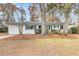 Charming single-story home with white brick, blue shutters, and a well-manicured front yard at 2462 Swallow Dr, Charleston, SC 29414