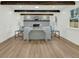 Stylish living room with beamed ceiling, shiplap walls, and a cozy fireplace at 2462 Swallow Dr, Charleston, SC 29414