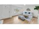 Bright living room with hardwood floors, white walls, and lots of natural light at 2462 Swallow Dr, Charleston, SC 29414