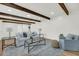 Elegant living room with beamed ceiling, shiplap walls, and plenty of natural light at 2462 Swallow Dr, Charleston, SC 29414