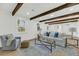 Elegant living room with beamed ceiling, shiplap walls, and plenty of natural light at 2462 Swallow Dr, Charleston, SC 29414