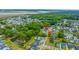 Aerial view highlighting a neighborhood with tree-lined streets, ponds, and a mix of home styles at 2596 Hatch Dr, Johns Island, SC 29455