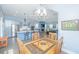 This eat-in dining area provides views of the kitchen, living room and has a rustic wood table at 2596 Hatch Dr, Johns Island, SC 29455