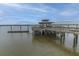 A wooden pier with a covered gazebo offers scenic waterfront views and leisure opportunities at 2596 Hatch Dr, Johns Island, SC 29455