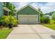 Exterior shot of a detached two car garage with a long driveway at 2596 Hatch Dr, Johns Island, SC 29455
