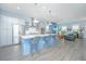 Modern kitchen island with bar stools, sleek appliances and an open concept at 2596 Hatch Dr, Johns Island, SC 29455