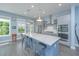 This spacious kitchen features an eat-in island, stainless steel appliances, and tons of natural light at 2596 Hatch Dr, Johns Island, SC 29455