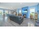 Open-concept living room with fireplace and modern blue decor at 2596 Hatch Dr, Johns Island, SC 29455