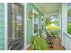 Relaxing front porch with rocking chairs and decorative plants at 2596 Hatch Dr, Johns Island, SC 29455
