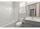 Bright bathroom features a shower-tub combo, a vanity, and a mirror at 267 Palmetto Walk Dr, Summerville, SC 29486
