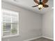 Light and airy bedroom featuring a ceiling fan and a large window letting in natural light at 267 Palmetto Walk Dr, Summerville, SC 29486