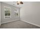 Neutral bedroom boasting ample natural light with dual windows and a charming ceiling fan at 267 Palmetto Walk Dr, Summerville, SC 29486