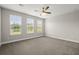 Bedroom with large windows providing natural light and a ceiling fan for comfort at 267 Palmetto Walk Dr, Summerville, SC 29486